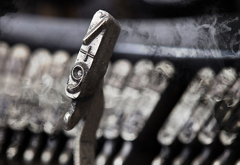 Image showing 9 hammer - old manual typewriter - mystery smoke