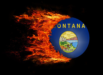 Image showing US state flag with a trail of fire - Montana