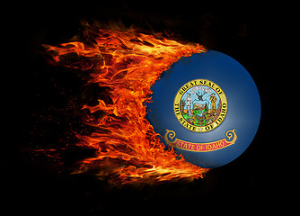 Image showing US state flag with a trail of fire - Idaho