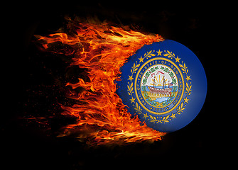 Image showing US state flag with a trail of fire - New Hampshire