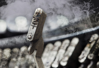 Image showing Half hammer - old manual typewriter - mystery smoke