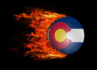 Image showing US state flag with a trail of fire - Colorado