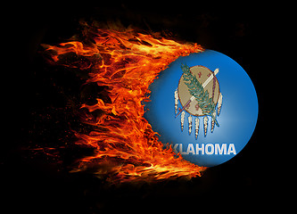 Image showing US state flag with a trail of fire - Oklahoma