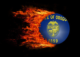 Image showing US state flag with a trail of fire - Oregon