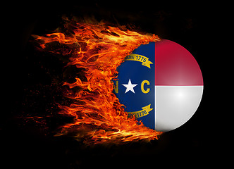 Image showing US state flag with a trail of fire - North Carolina