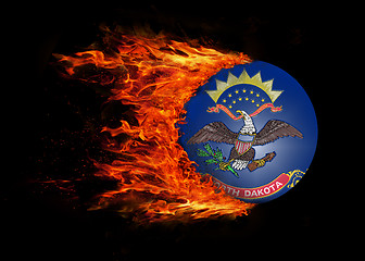 Image showing US state flag with a trail of fire - North Dakota