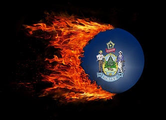 Image showing US state flag with a trail of fire - Maine