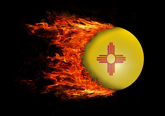 Image showing US state flag with a trail of fire - New Mexico