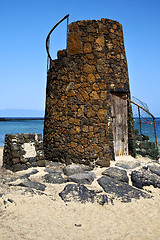 Image showing tower spain  hill yellow  beach    black rocks   lanzarote 
