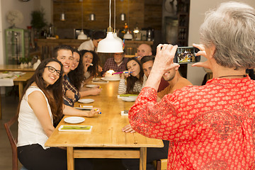 Image showing Granny taking a picture of all family