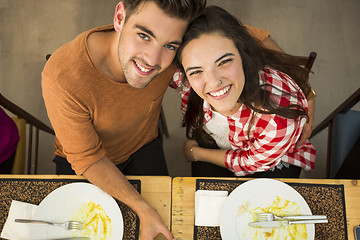 Image showing Young couple at the restaurant