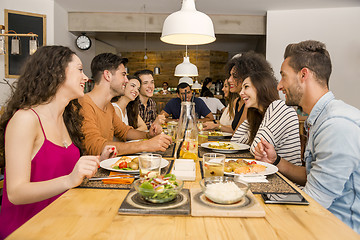 Image showing Friends lunching at the restaurant