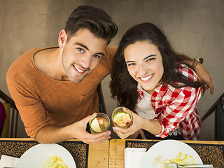 Image showing Young couple toasting