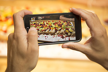 Image showing Taking a picture of the dessert