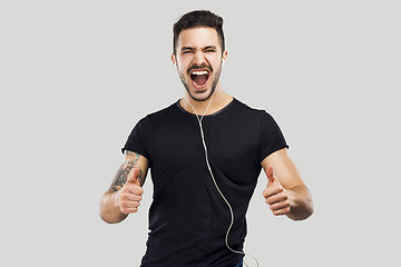 Image showing Happy man listen music