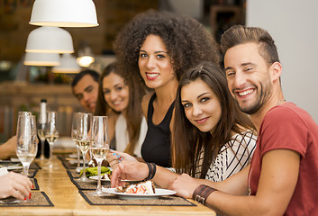 Image showing Friends lunching at the restaurant