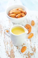 Image showing almond essential oil and almond in bowl