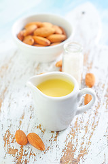 Image showing almond essential oil and almond in bowl