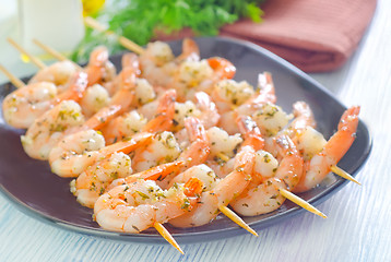 Image showing boiled shrimps are beaded on sticks