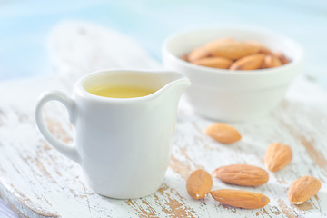 Image showing almond essential oil and almond in bowl