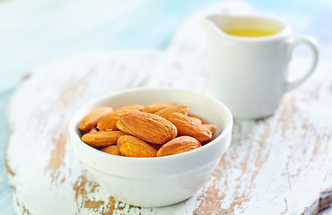 Image showing almond essential oil and almond in bowl