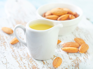 Image showing almond essential oil and almond in bowl