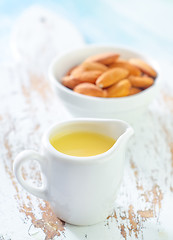 Image showing almond essential oil and almond in bowl