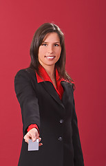 Image showing Businesswoman offering a credit card