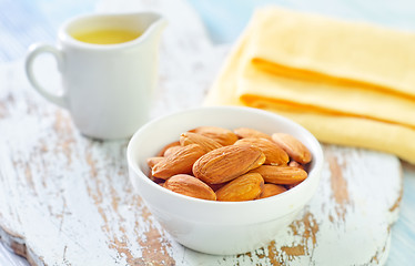 Image showing almond essential oil and almond in bowl