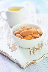 Image showing almond essential oil and almond in bowl