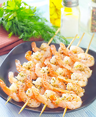 Image showing boiled shrimps are beaded on sticks