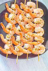 Image showing boiled shrimps are beaded on sticks