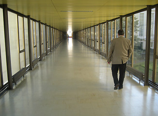 Image showing Walking a long corridor