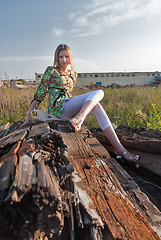 Image showing Pretty girl on industrial background