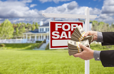 Image showing Man Handing Over Money in Front House For Sale, Sign