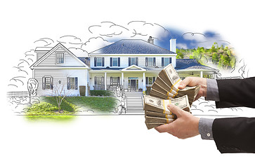 Image showing Hand Holding Thousands In Cash Over House Drawing and Photo