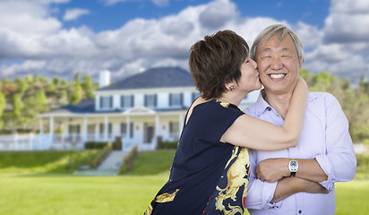 Image showing Affectionate Senior Chinese Couple In Front of Beautiful House