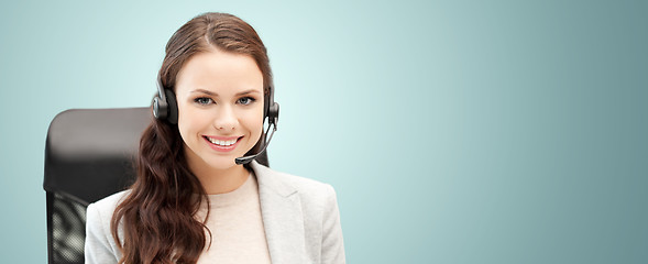 Image showing smiling female helpline operator with headset