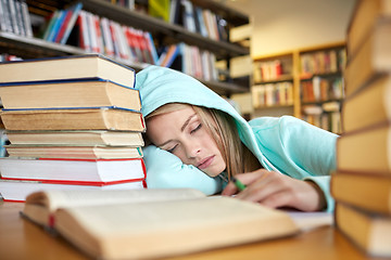 Image showing student or woman with books sleeping in library