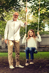 Image showing happy family in front of house outdoors