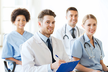 Image showing group of happy doctors on seminar at hospital