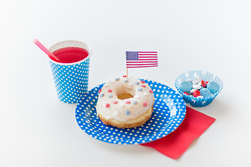 Image showing donut with juice and candies on independence day