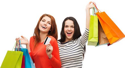 Image showing teenage girls with shopping bags and credit card