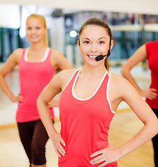 Image showing group of smiling people exercising in the gym