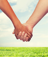 Image showing woman and man holding hands