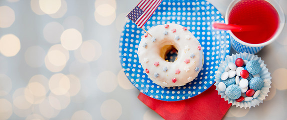 Image showing donut with juice and candies on independence day