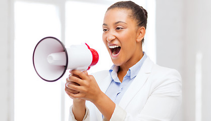 Image showing strict businesswoman shouting in megaphone