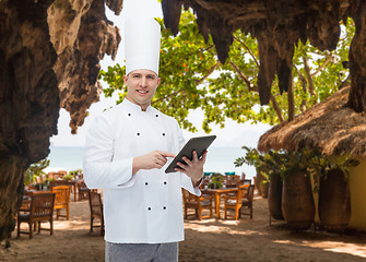 Image showing happy male chef cook holding tablet pc