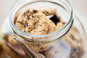 Image showing close up of chocolate oatmeal cookies in glass jar