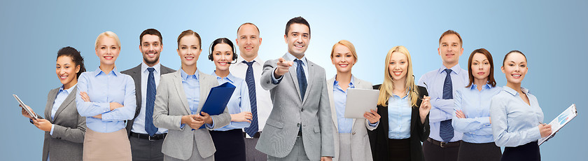 Image showing group of happy business people pointing at you